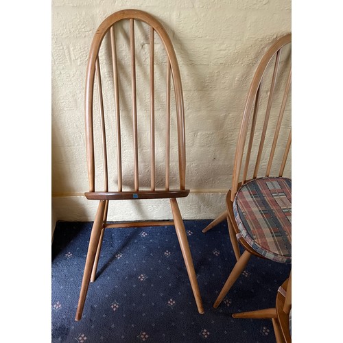 92 - A set of four stick back Ercol dining chairs.