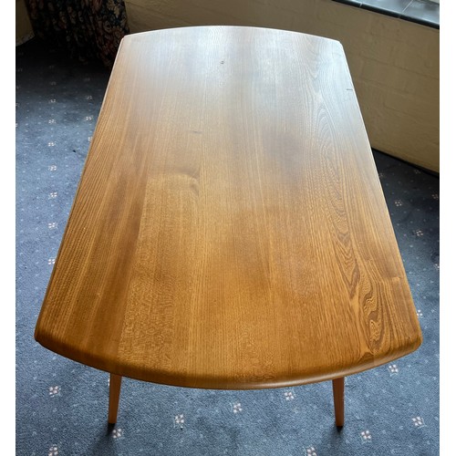 93 - A drop leaf Ercol dining table, 124 x 113cm extended.