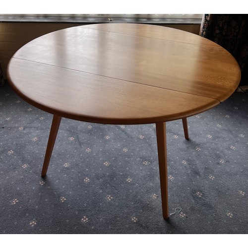 93 - A drop leaf Ercol dining table, 124 x 113cm extended.