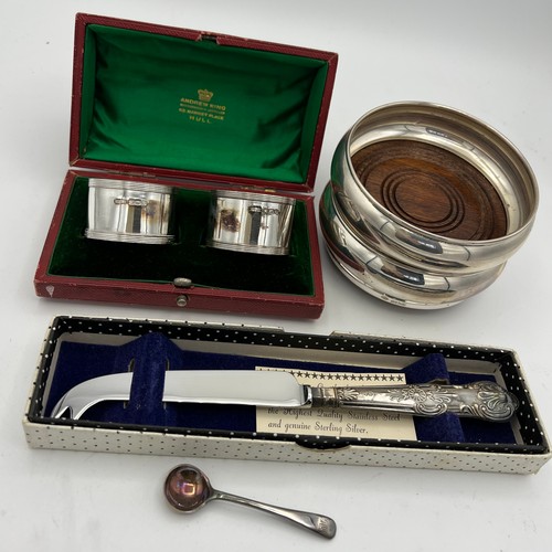 732 - Siver to include a pair of coasters, boxed napkin rings, salt spoon and a silver handled knife. Vari... 