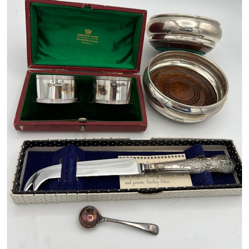 732 - Siver to include a pair of coasters, boxed napkin rings, salt spoon and a silver handled knife. Vari... 