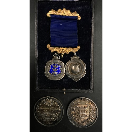 734 - Four silver hallmarked medals, one bearing the Hull three crowns crest and two awarded for 'Perfect ... 