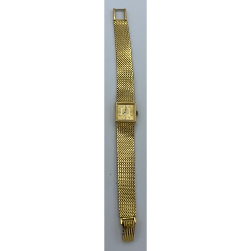 983 - A ladies 18 carat yellow gold Omega wristwatch. Total weight 37.8gm.