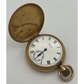 A nine carat gold hunter pocket watch by Waltham. Keyless wind with white enamel dial with Roman num... 