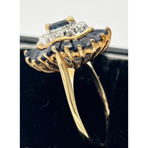 577 - A nine carat gold ring set with baguette cut sapphires and diamonds. Size M, weight 3.9gm.