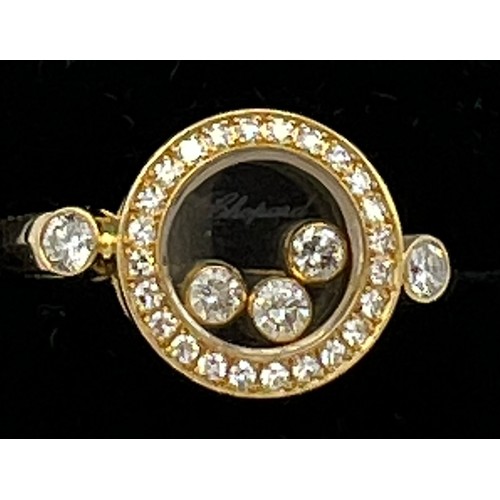 578 - An 18 carat Chopard ‘Happy Diamonds” diamond ring, the round bezel set with three floating brilliant... 