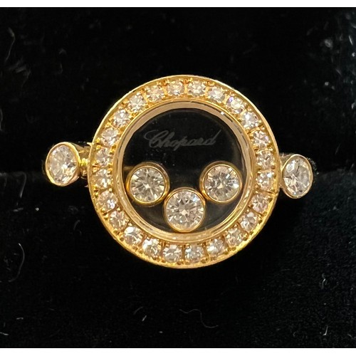 578 - An 18 carat Chopard ‘Happy Diamonds” diamond ring, the round bezel set with three floating brilliant... 