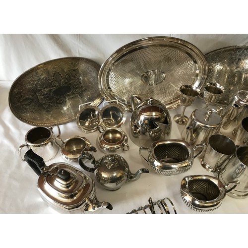 691 - A large collection of silverplate and pewter items to include three trays, kettles, coffee pots, cup... 