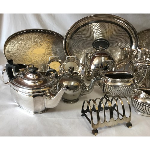 691 - A large collection of silverplate and pewter items to include three trays, kettles, coffee pots, cup... 