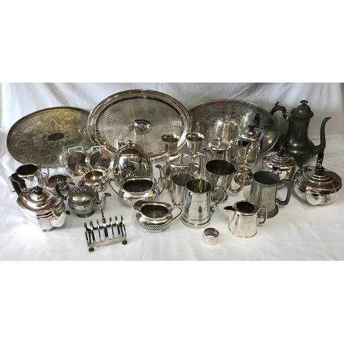 691 - A large collection of silverplate and pewter items to include three trays, kettles, coffee pots, cup... 