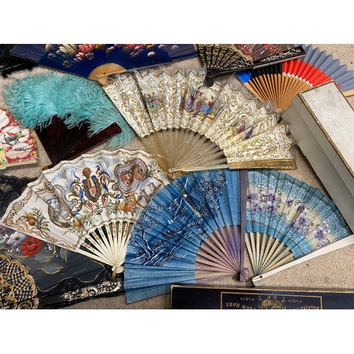 922 - A collection of various fans to include wood, bone, plastic, paper, silk, feathers etc.