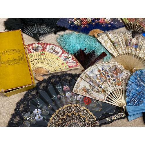 922 - A collection of various fans to include wood, bone, plastic, paper, silk, feathers etc.