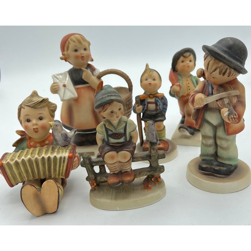332 - Six Hummel figures by Goebel. Tallest, girl with basket 13cm h, smallest boy with accordion 9cm h.