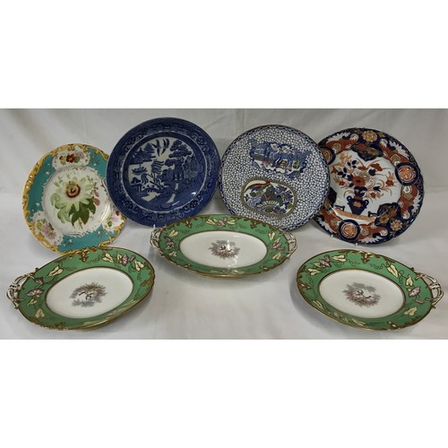 358 - Seven ceramics to include 4 plates and three tazzas. The tazzas are green and white and two have one... 