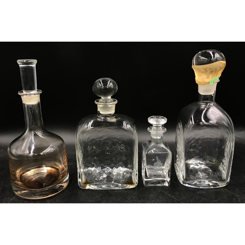 419 - Four decanters, largest, 27 x 12cm diameter, smallest 14.5 with 