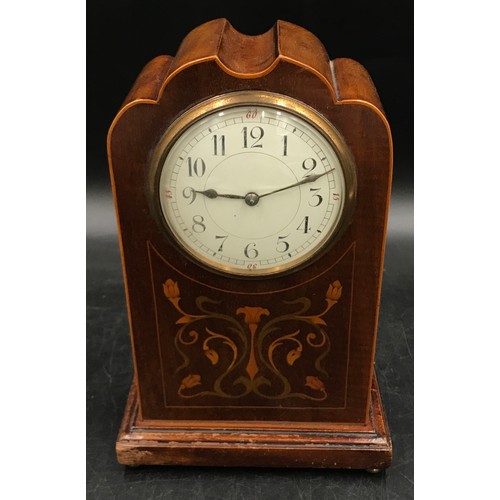 1195 - Inlaid mahogany mantle clock in the Art Nouveau style, 24 h x 16cm w, on four brass feet.