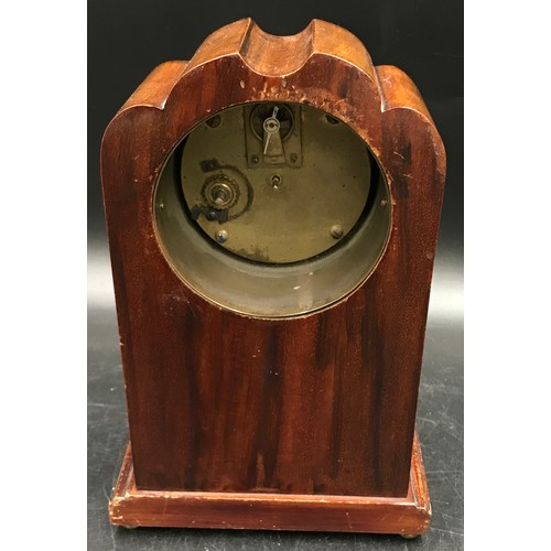 1195 - Inlaid mahogany mantle clock in the Art Nouveau style, 24 h x 16cm w, on four brass feet.