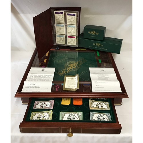 828 - Franklin Mint large Monopoly chest 'The Collectors Edition' with pull out drawer and real estate por... 