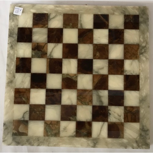 829 - Onyx chess board and pieces, board 36cm square, King 7cm h. Pieces in a Simmers Biscuit Tin.