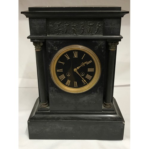 1193 - A Victorian slate mantle clock with column supports. 
With pendulum.