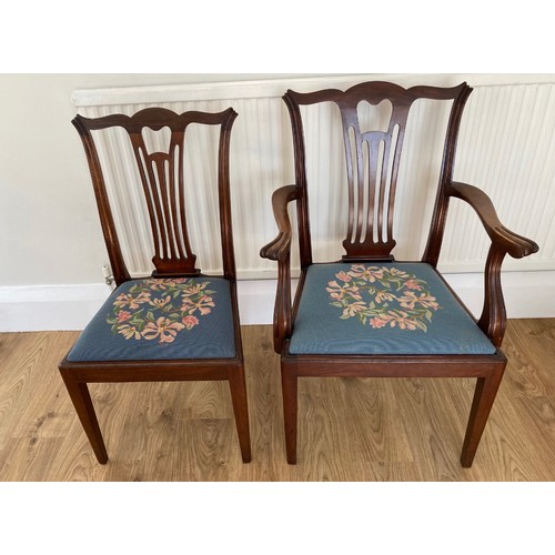 86 - A set of six mahogany dining chairs to include 2 carvers with needlework drop in seat covers.