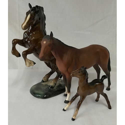 347 - Collection of three horses one rearing horse by Beswick, a foal by Beswick and a Royal Doulton horse... 