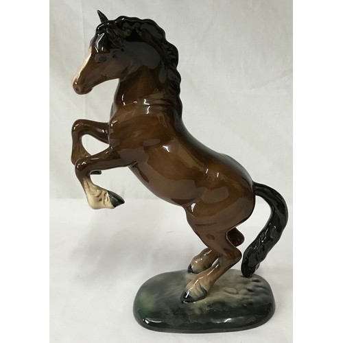 347 - Collection of three horses one rearing horse by Beswick, a foal by Beswick and a Royal Doulton horse... 