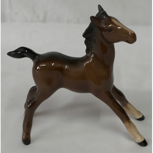 347 - Collection of three horses one rearing horse by Beswick, a foal by Beswick and a Royal Doulton horse... 