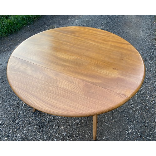 122 - Ercol oval dining table with two drop leaves 125 x 113.5 x 71cm fully extended and 61.5 with leaves ... 