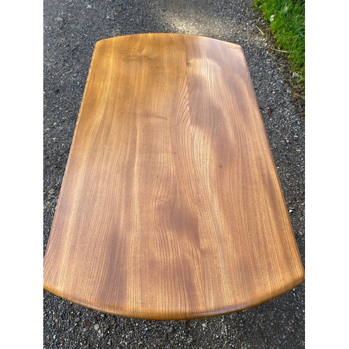 122 - Ercol oval dining table with two drop leaves 125 x 113.5 x 71cm fully extended and 61.5 with leaves ... 