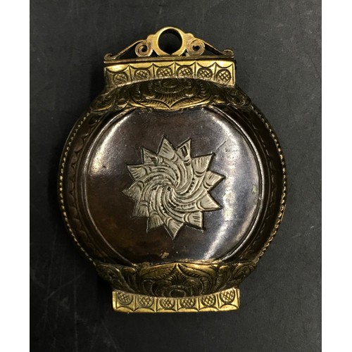 943 - Middle Eastern interest- a silver inlaid and niello compact with a copper interior. 7 x 5.5cm.