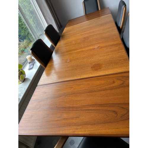 114 - G Plan dining table and six leather covered chairs including 2 carvers. Table extended 244cm l x 89c... 