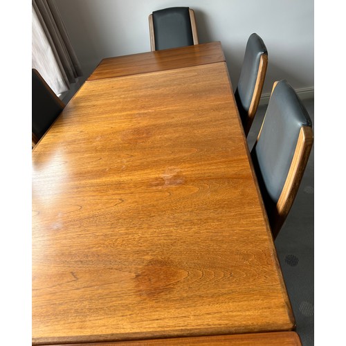 114 - G Plan dining table and six leather covered chairs including 2 carvers. Table extended 244cm l x 89c... 