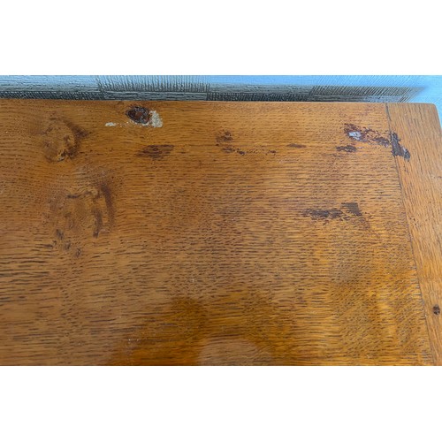 1162 - A Robert Mouseman Thompson panelled oak blanket box with hinged top on short octagonal baluster supp... 