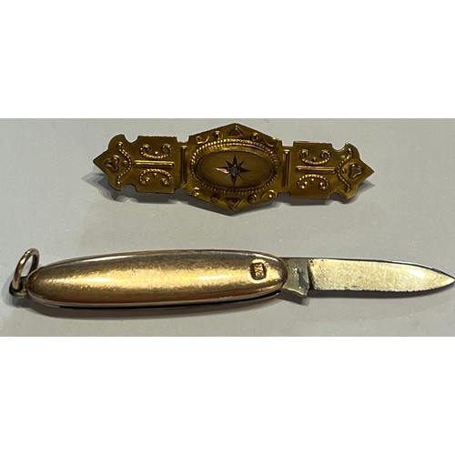 591 - An Edwardian 9 carat gold bar brooch with diamond chip and a 9 carat gold cased miniature penknife l... 