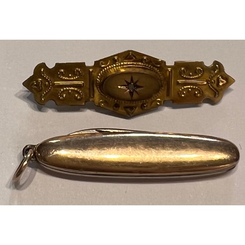 591 - An Edwardian 9 carat gold bar brooch with diamond chip and a 9 carat gold cased miniature penknife l... 