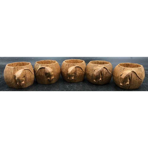 1160 - Five Robert 'Mouseman' Thompson carved octagonal oak napkin rings.