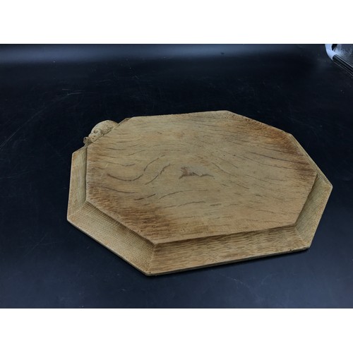 1161 - A Robert 'Mouseman' Thompson octagonal cheeseboard 30.5 x 25cm.