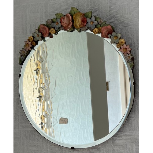 1144 - Floral decorated bevel edged wall mirror. 37cm.