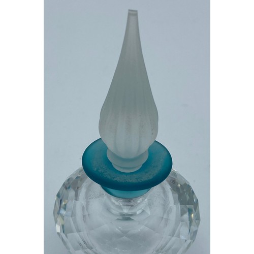 408 - Three Swarovski crystal perfume bottles with stoppers one with dolphins modelled to the stopper, tal... 