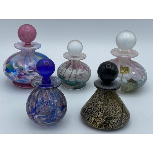 409 - Five Isle of Wight perfume bottles with stoppers together with another unlabelled possibly Isle of W... 