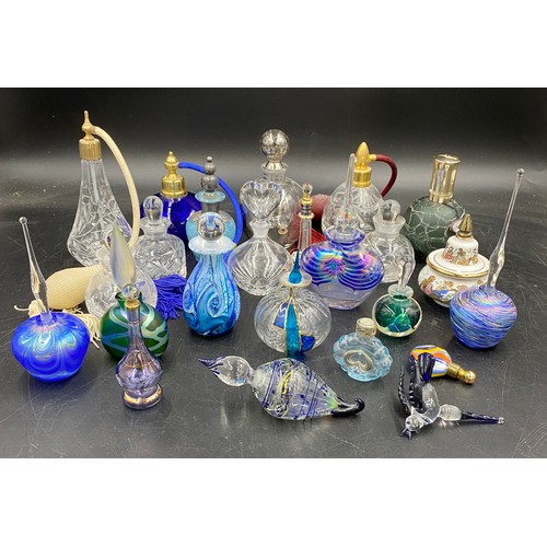 411 - A large collection of various glass perfume bottles to include one labelled Gozo, Waterford Marquisb... 