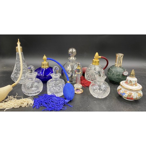 411 - A large collection of various glass perfume bottles to include one labelled Gozo, Waterford Marquisb... 