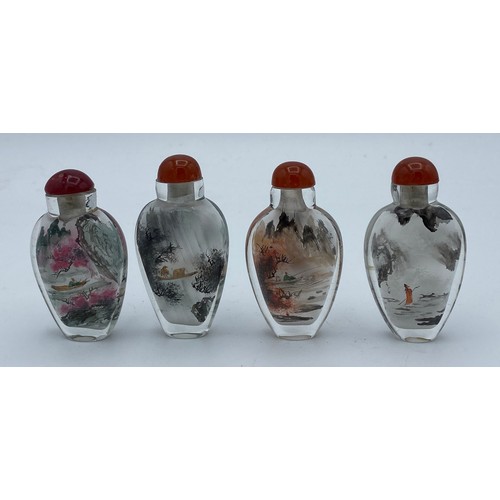 406 - Four Chinese painted perfume bottles in case depicting figures throughout the four seasons.