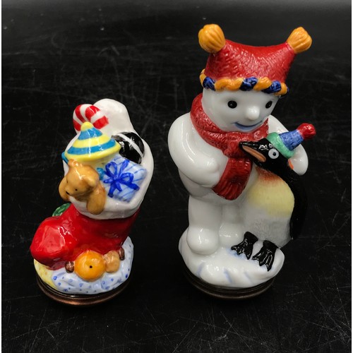 447 - Halcyon Days enamels to include two bonbonnieres in the form of a snowman and a stocking together wi... 