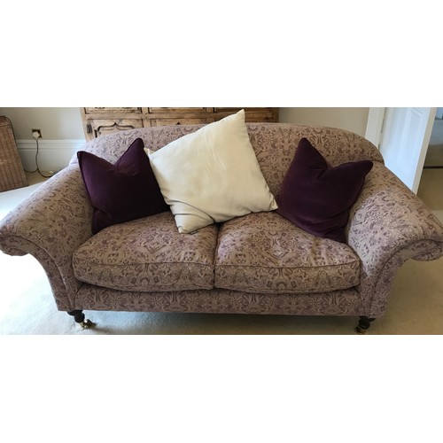 111 - Two sofas and a matching armchair in a light coloured patterned moquette one sofa 223 the other 196 ... 