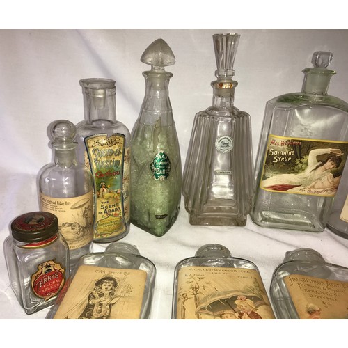 412 - A collection of vintage glass bottles, some old medicine bottles, with labels to include, Humphreys ... 