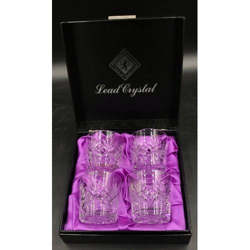 414 - A boxed Edinburgh International hand cut set of four lead crystal glasses.