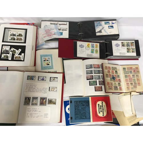 680 - Mixture of world and GB stamps in 8 albums, mint and used stamps plus a few FDC's and loose stamps.