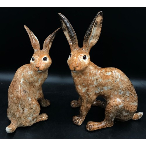 253 - Two Winstanley brown hares, one size 6 the other size 8, both signed to base.